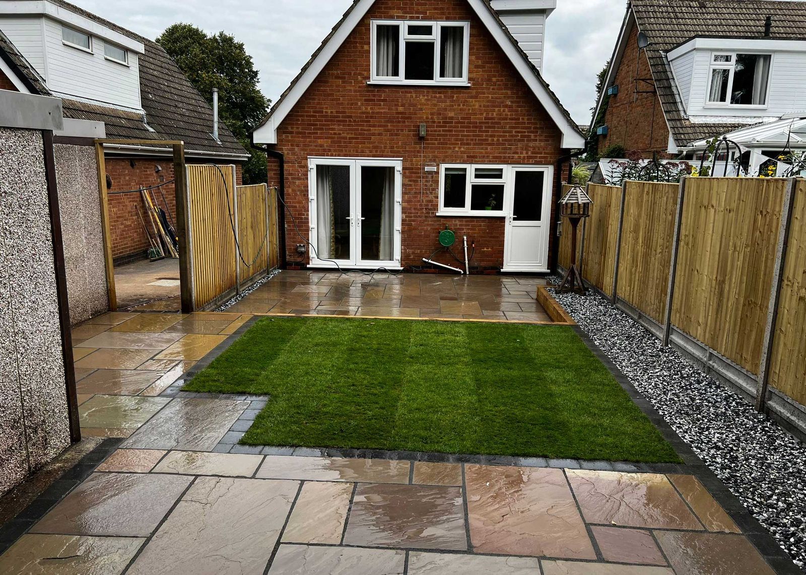Garden transformation with fresh turf, sandstone paving and new fencing